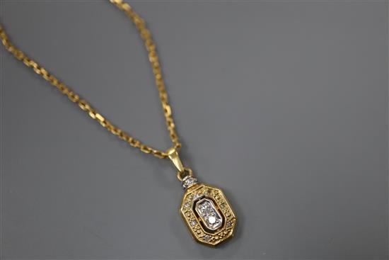 A modern yellow metal (stamped 750) and diamond set pendant, 13mm, on an unmarked yellow metal chain, gross 5.5 grams.